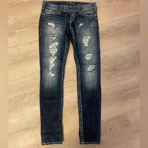 Silver distressed skinny jeans